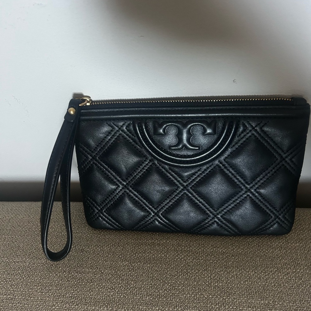 Tory Burch black embossed leather wristlet. Worn only once. Like new.